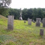 Different size stones with the crypt mound to the left