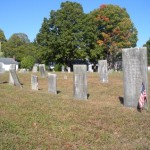 Approaching a neat row of headstones