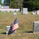 2 small weathered headstones